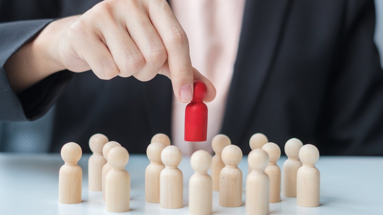 Businesswoman hand pulling leader man wooden from crowd of employees. Toxic People, Human resource