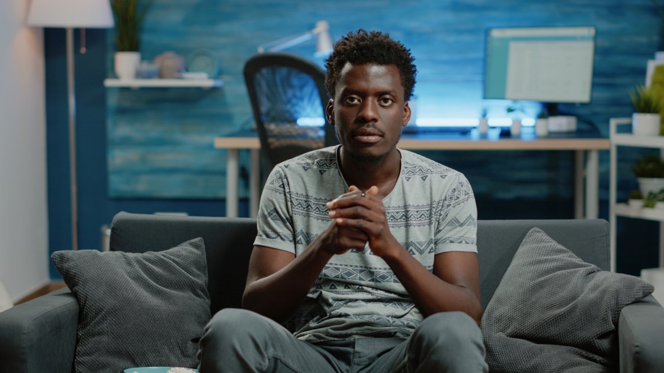 POV of person cheering at football game on television