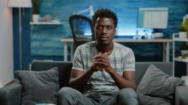 POV of person cheering at football game on television