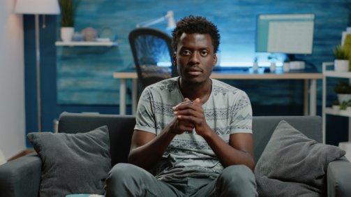 POV of person cheering at football game on television