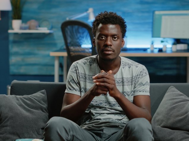 POV of person cheering at football game on television